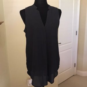 Sleeveless Shirt tail blouse